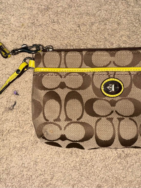 Coach Handbags - Coach Brown Signature Canvas Wristlet with Yellow Accent
